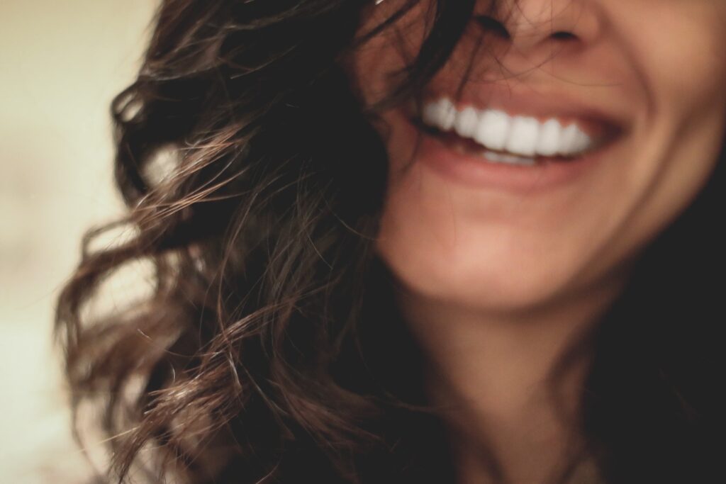 true happiness and fulfillment: long black haired woman smiling close-up photography