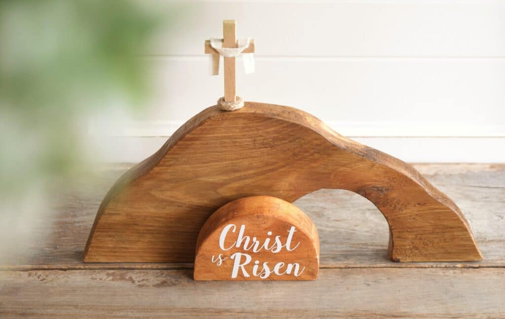 Christ-likeness: a wooden cross on top of a wooden stand